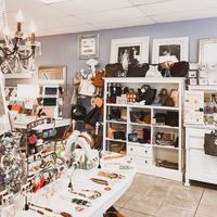 In store image of bracelets, erring, rings, bags, and more accessories.